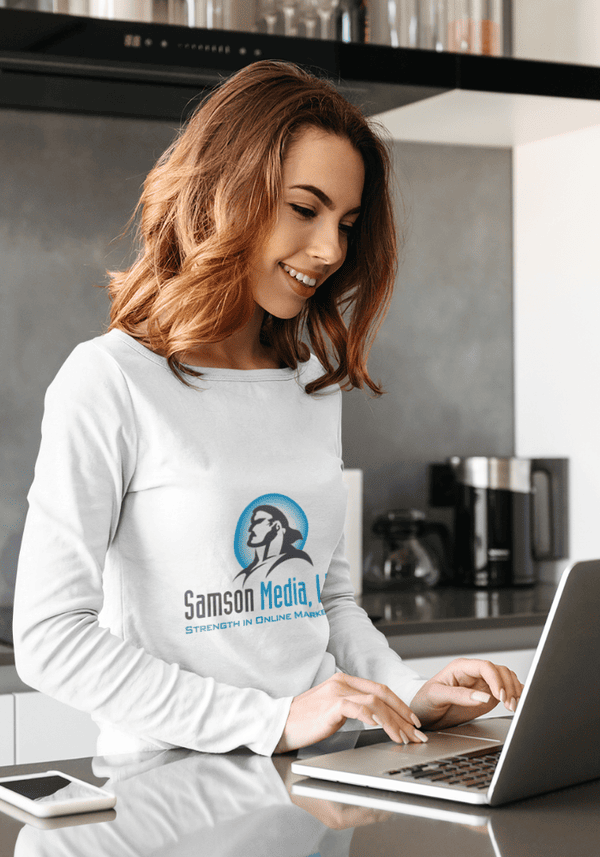 Lady on laptop with a Samson Media Shirt